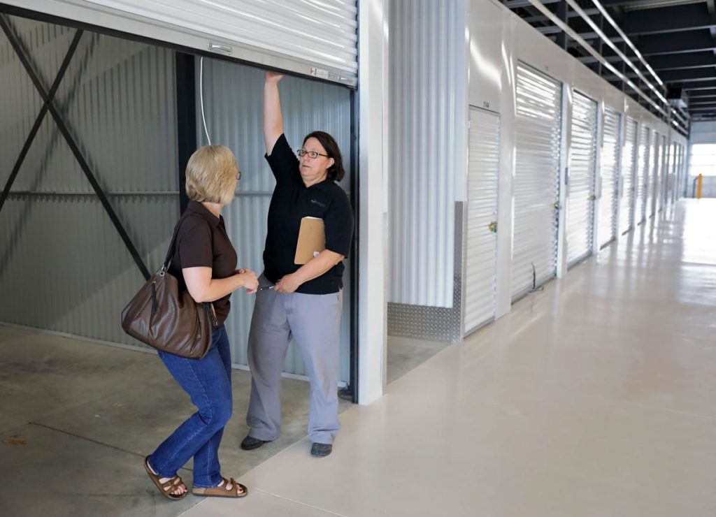Two woman checking out a Self-Storage unit.