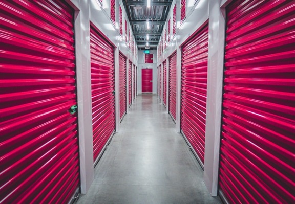 A row of various storage units with doors securely shut and organized.